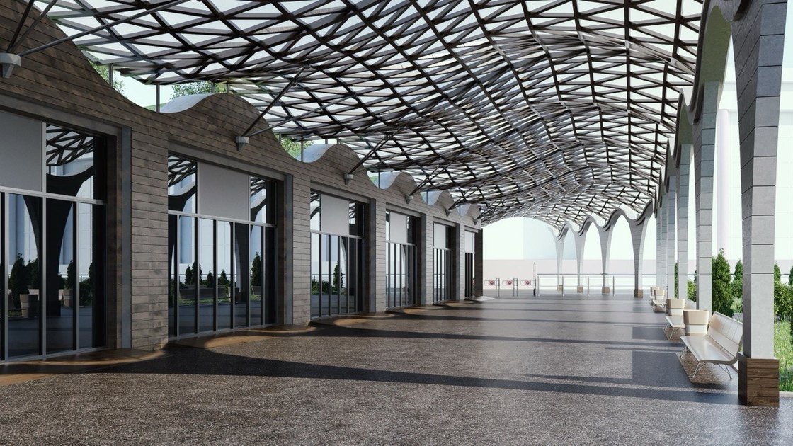 The arcade from the forecourt, its arches glazed between the piers