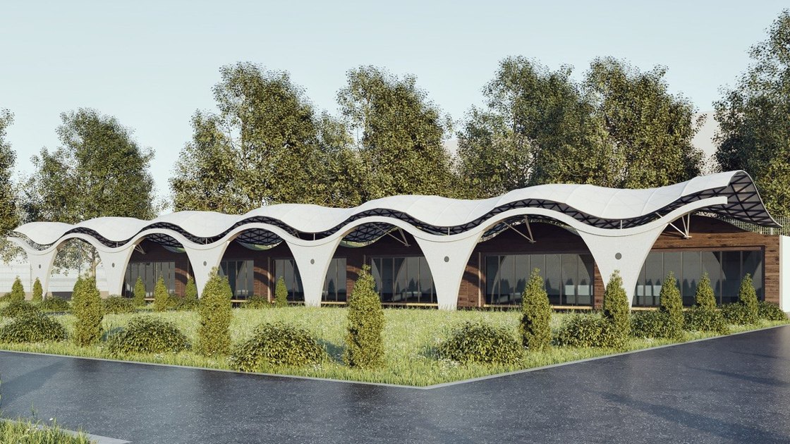 The dark diagrid roof variant seen from the landscaped strip