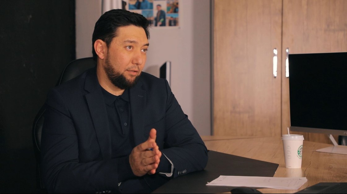 Rustam Khaitmetov at his desk